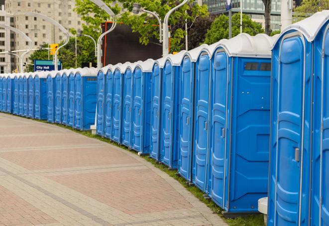 a row of portable restrooms set up for a special event, providing guests with a comfortable and sanitary option in Marion, IL